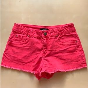 Bright pink denim shorts